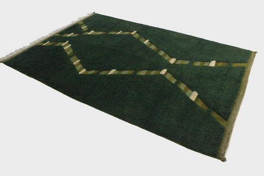 Green rug with geometric pattern 