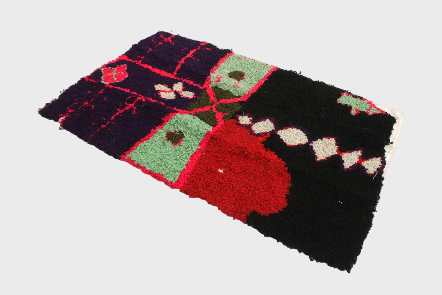 Decorative rug with colorful patterns on a white background