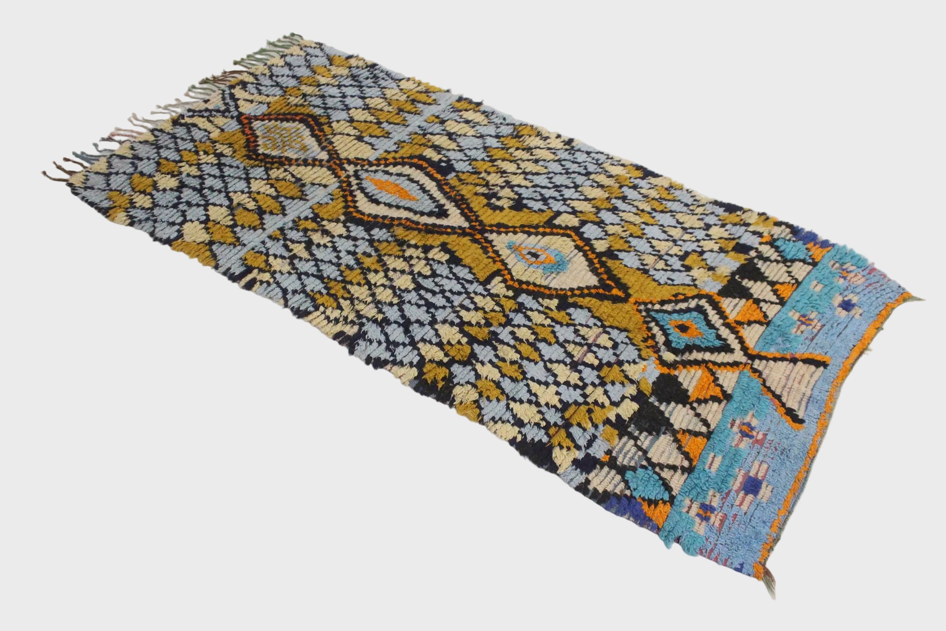 Decorative rug with geometric pattern on a white floor