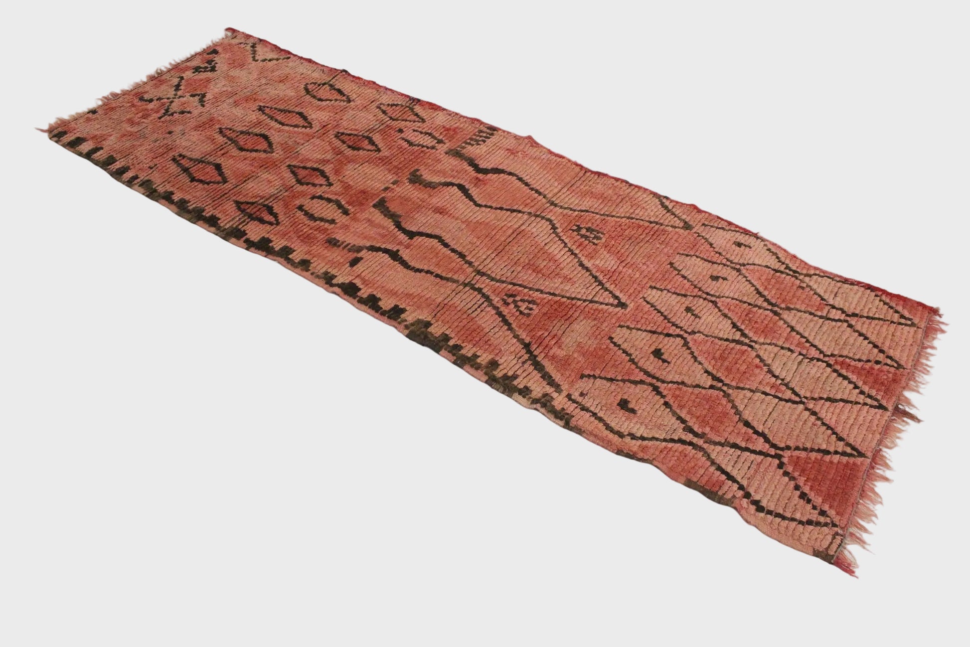 Woven textile with geometric pattern on a white background