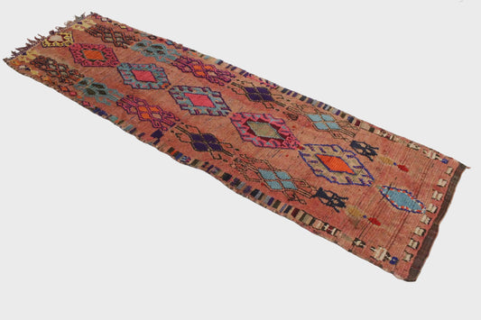 Decorative rug with geometric pattern on a white floor